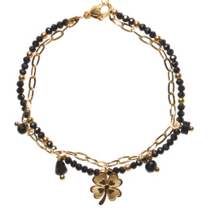 Bracelet double rangs composé d'une chaîne en acier doré avec pampilles perles de couleur noire et un trèfle à quatre feuilles en acier doré serti d'un cristal noir, ainsi qu'une chaîne avec des perles en acier doré et des perles de couleur noire. Fermoir mousqueton avec 3 cm de rallonge.