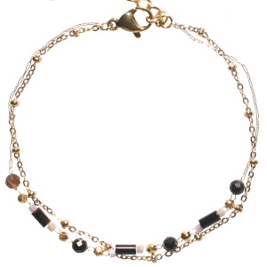 Bracelet double rangs composé d'une chaîne en acier doré et d'une chaîne en acier doré avec perles de couleur noire. Fermoir mousqueton avec 3 cm de rallonge.