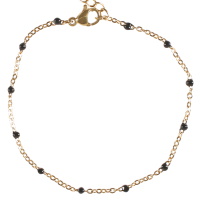 Bracelet composé d'une chaîne en acier doré et de perles en émail de couleur noire. Fermoir mousqueton avec 4 cm de rallonge.