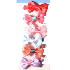 Lot de 6 élastiques pour cheveux pour enfants avec nœud papillon en textile multicolore.