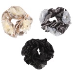 Chouchou fleurs en textile, perles et cristaux. 3 coloris différents. Vendu à l'unité.